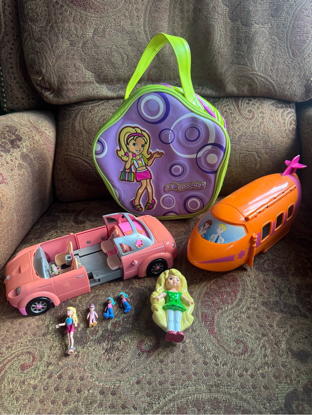Polly Pocket lot. Bag, airplane, limo, dolls